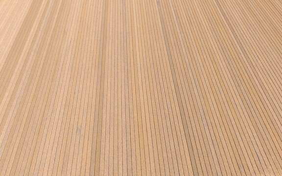 Aerial view of the geometric patterns of a cultivated agricultural field with straight parallel furrows and earthy textures in Heiloo, North Holland, Netherlands.