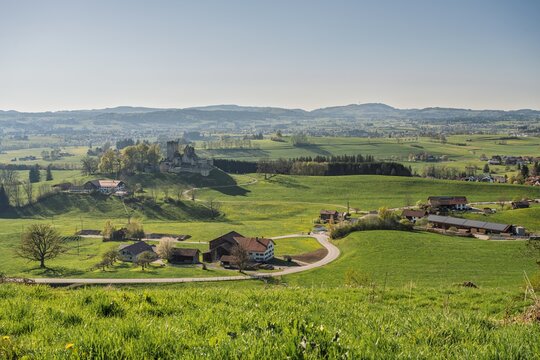 The historic castle ruins of Sulzberg in Allg&auml;u, Bavaria. Spring landscape with green hills and the Blender mountain with its radio tower in the background. Idyllic medieval heritage site.