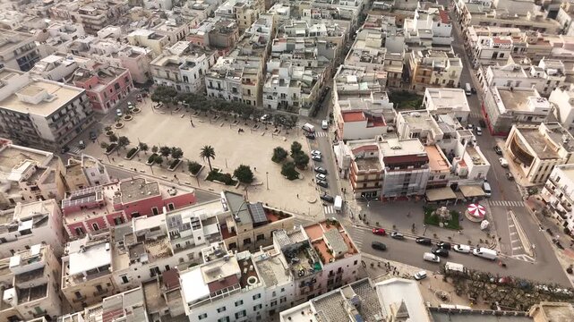 Aerial view of Polignano a Mare town square and coastal urban streets Italy