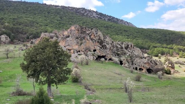 Inkaya or Inyayla is a lesser-known but impressive rock settlement in the Phrygian highlands near Seyitgazi, featuring volcanic tuff formations carved by Phrygians, later reused by Roman and Byzantine