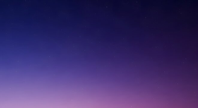 A gradient of deep blue transitioning to vibrant purple and pink hues in the twilight sky.