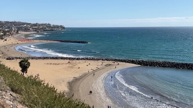 Coastline view of Gran Canaria with sandy beach and turquoise waters