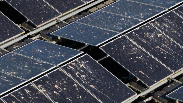 Aerial view of floating solar panels at Sekdoornse Plas covered in bird droppings in Zwolle, Overijssel, Netherlands.