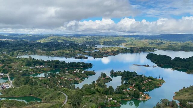 Sweeping panoramic view from the top of El Pe&ntilde;ol Rock (La Piedra). Stunning perspective of the turquoise lakes, lush islands, and scenic landscape of the Guatap&eacute; reservoir in Antioquia, Colombia.
