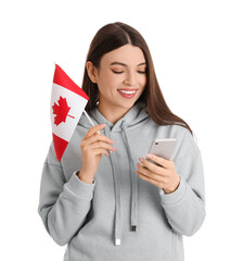 Naklejka premium Young woman with flag of Canada using mobile phone on white background