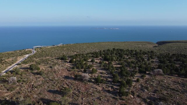 Aerial approach to the suspended walkways of Santa Pola with Tabarca island in the background. Spain
