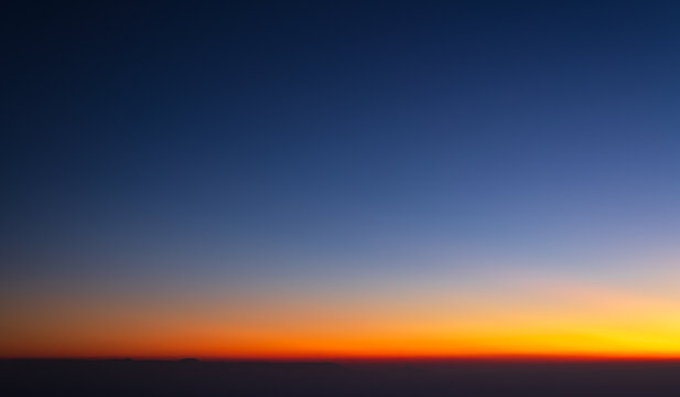 Sunrise colorful orange, red, blue and yellow beautiful sky. Nature background.