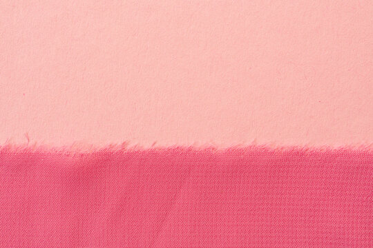 Pastel pink chiffon fabric with frayed edge on soft background airy minimal textile backdrop