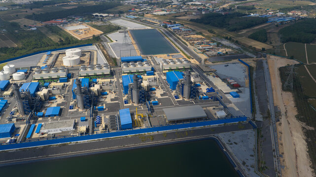 Aerial view of Sriracha Power Plant GSRC with blue industrial buildings, cooling towers, and large storage tanks Tambon Khao Khan Song, Chang Wat Chon Buri, Thailand.