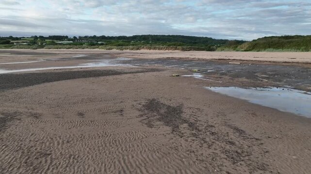 Aerial View of Low Tide Mudflats and Tidal Pools at Lligwy Beach Anglesey North Wales