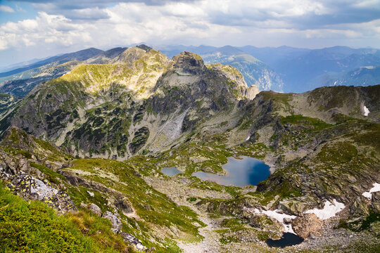 Panoramic view of Elenino Lake beneath Malyovitsa Peak in Rila Mountain Bulgaria