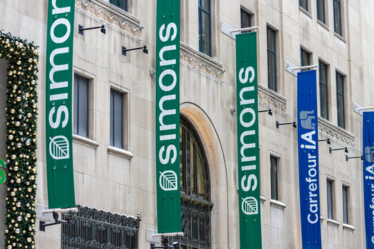 MONTREAL, CANADA, 25 December 2025 : Simons store exterior banners urban architecture Christmas decorations