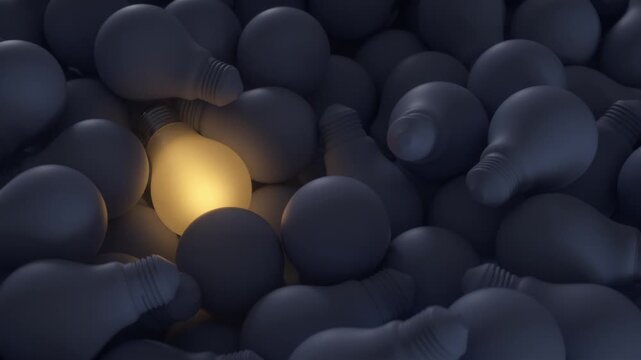 Big ideas. Illuminated light bulb among the rest of the unlit bulbs.
