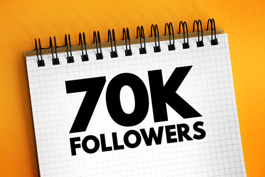 70K Followers - reaching 70,000 followers on a social media platform or other online platform, text concept on notepad