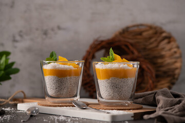 Mango Chia Seed Pudding with Coconut and Mint in Glass Cups © homydesign
