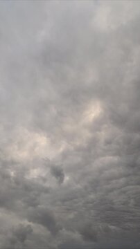 Opposite clouds drift with tension. Sky scenes showing contrasting swirling clouds. Wideangle sky sequence capturing opposing cloud flows and moody atmospheric shades
