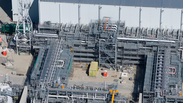 Drone view of Holland Hydrogen I on Tweede Maasvlakte, a major green hydrogen plant powered by offshore wind for sustainable industry and freight transport.