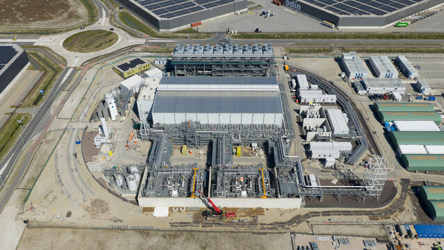 Drone view of Holland Hydrogen I on Tweede Maasvlakte, a major green hydrogen plant powered by offshore wind for sustainable industry and freight transport.