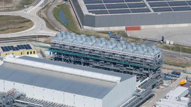 Drone view of Holland Hydrogen I on Tweede Maasvlakte, a major green hydrogen plant powered by offshore wind for sustainable industry and freight transport.