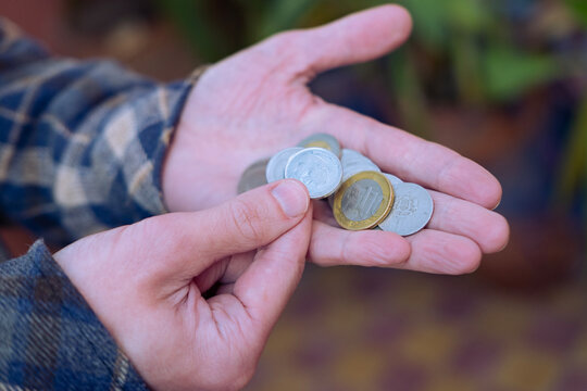 closeup male hands hold Moroccan dirham money, centimes coins, count paper dirham banknotes, concept cash payments, monetary savings, exchange and cashing currency