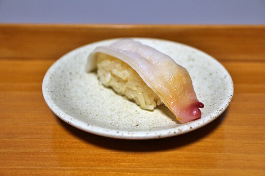 Shiromirugai (Japanese geoduck) Edomae nigirizushi made with red vinegar purchased at a supermarket in Tokyo, Japan