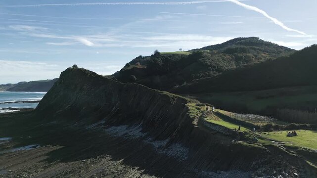 Stunning aerial shot revealing the unique flysch rock formations on the Basque Coast of Sakoneta, a famous geological park and a protected area near Zumaia, a popular tourist attraction