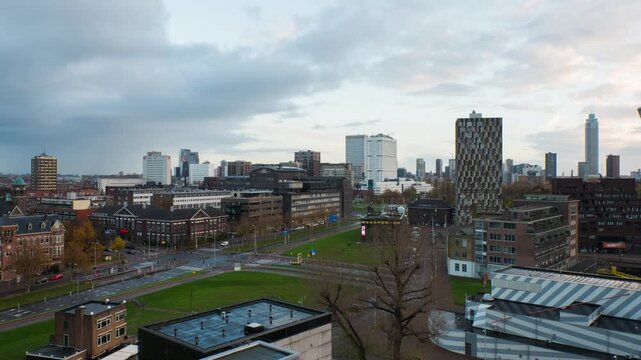 Rotterdam, Netherlands. Aerial view of the city Rotterdam, Netherlands during the evening with cloudy sky. Time-lapse with car, zoom in