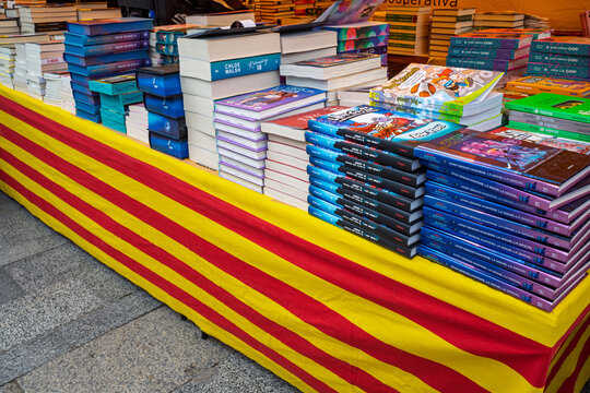 Barcelona, Spain May 1, 2026: Books on Senyera.