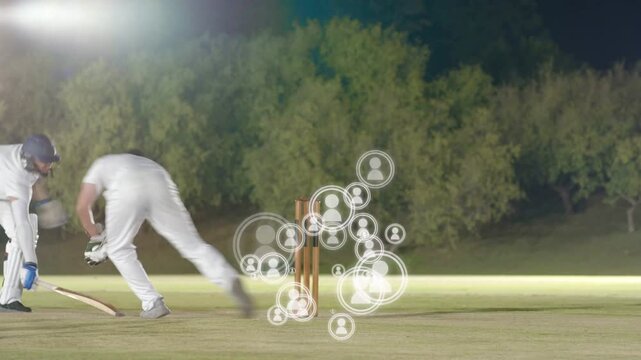 On ball batter playing shot, running to score while keeper collecting, sports icons crowding stumps