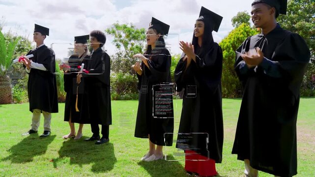 Seven grads in gowns clapping after offframe cue, one stepping greeting peer celebrating graduation