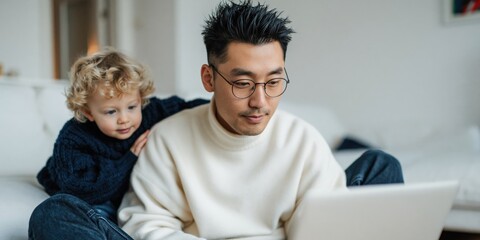 Obraz premium Man and child working on laptop in home living room on sofa