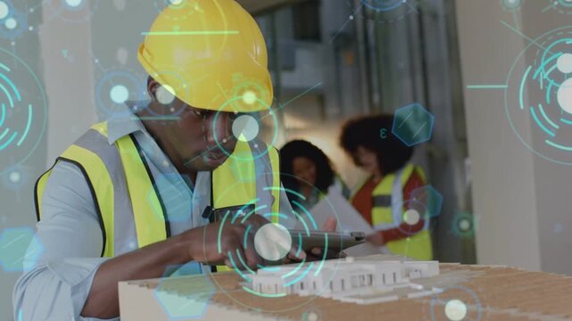 Construction tech studying tablet, aligning scanner over model, capturing data with AR HUD