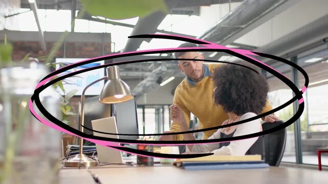 Woman using laptop while man leaning, pointing, animated oval sweeping in circling for office task