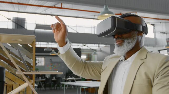 Designer with VR headset raising right hand starting laser beams, adjusting wood model for design