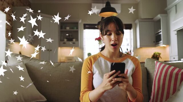Woman tapping phone on sofa causing stars overlay, shifting from neutral to smile for social media