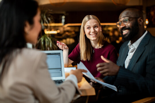 Business clients meeting advisor in cozy cafe