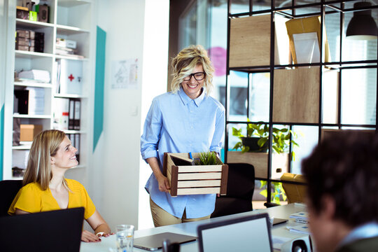 Smiling woman starting new job at modern office