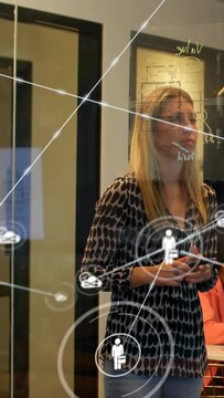 Vertical video: Presenter showing business network, writing on glass, initiating nodes around hands