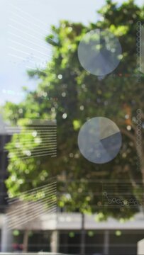 Vertical video: Tree canopy filling frame, data stream activating HUD overlays for urban tech view