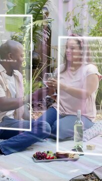 Vertical video: Man reaching for wine, handing glass to woman, code frames floating during toasting
