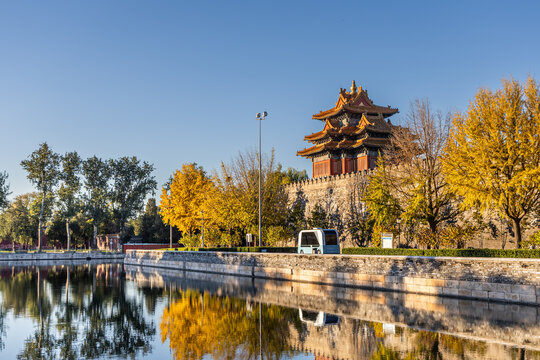 Sunrise view of Forbidden City watch tower next to surrounding scenic moat to ensure security of the palace, Beijing China.
