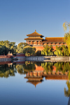 Scenic Forbidden City watch tower with reflection from the moat. One of Beijing China most popular tourist destination