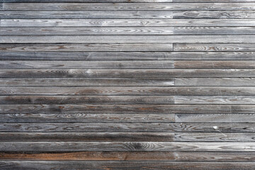 Obraz premium a weathered wooden wall featuring horizontal grey planks with prominent natural grain and textures