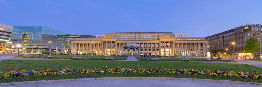 Stuttgart, Germany - April 17, 2026: Illuminated K&ouml;nigsbau shopping arcade and Kunstmuseum at Schlossplatz during dusk