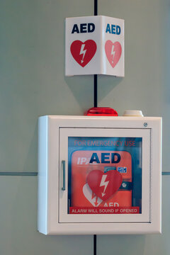 Singapore - 28 December, 2025: Close-up of AED or Automated External Defibrillator installed on wall in Changi Airport Singapore as first aid in heart attack emergency situation