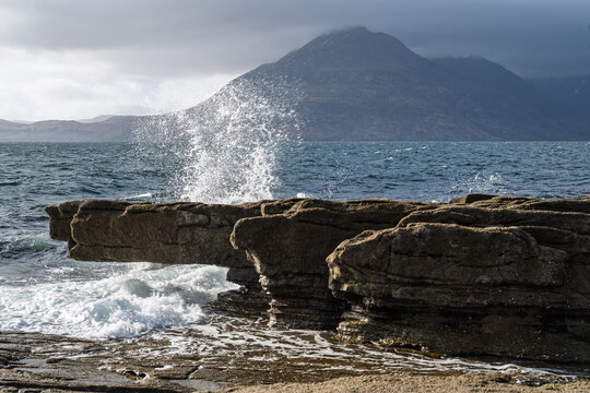 Photograph of Elgol in Scotland showing waves, rocks and mountains