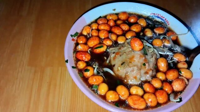 Indonesian Street Food Meatball with Peanuts and Soy Sauce in Bowl