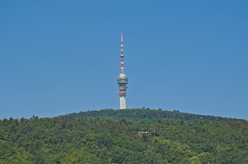 Obraz premium Television tower on the Misina peak of Mecsek mountains, surrounded by forest. Pecs, Hungary 
