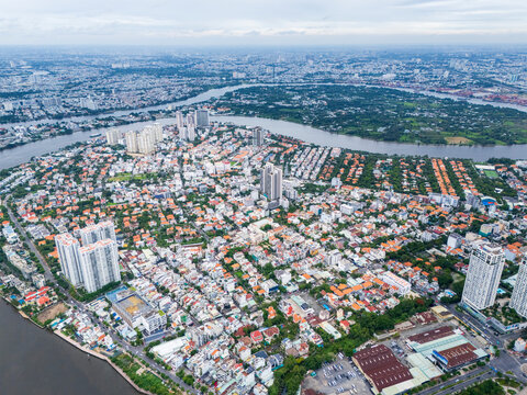 High-angle drone view of Thao Dien district and Saigon River in Ho Chi Minh City, Vietnam.