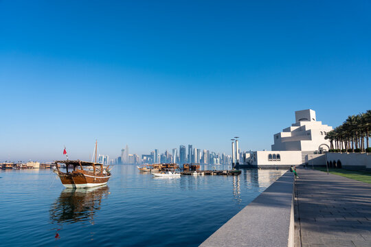 Traditional Dhow Boats Near Museum of Islamic Art with Doha Skyline Qatar